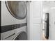 Laundry area featuring a stackable washer and dryer in a modern, well-lit space at 2479 Peachtree Ne Rd # 1801, Atlanta, GA 30305