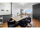 Bright, open living space with modern dining area, hardwood floors, and large windows with city views at 2479 Peachtree Ne Rd # 1801, Atlanta, GA 30305