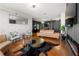A luxury home featuring a hardwood floor, cowhide rug, comfortable seating, and high end finishes at 2479 Peachtree Ne Rd # 1801, Atlanta, GA 30305