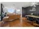 This open-concept living area features hardwood floors, city views, and designer accents at 2479 Peachtree Ne Rd # 1801, Atlanta, GA 30305