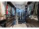 Spacious walk-in closet with custom shelving and ample storage for clothes and shoes at 2479 Peachtree Ne Rd # 1801, Atlanta, GA 30305