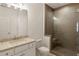 Elegant bathroom with a glass shower, quartz countertops, and modern fixtures at 6790 Encore Blvd, Sandy Springs, GA 30328