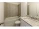 Well-maintained bathroom features a tiled shower-tub combo, toilet, and a vanity with a white marble countertop at 6790 Encore Blvd, Sandy Springs, GA 30328
