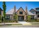 Aria community clubhouse with stone facade, manicured landscaping, and decorative entrance at 6790 Encore Blvd, Sandy Springs, GA 30328