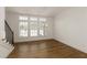 Open dining room with a modern chandelier and view from the window at 6790 Encore Blvd, Sandy Springs, GA 30328