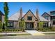 Clubhouse featuring stone facade, shingle roof, manicured landscaping, and inviting entrance, perfect for community gatherings at 6790 Encore Blvd, Sandy Springs, GA 30328