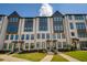 Beautiful townhome with brick exterior, dark windows, and well-maintained landscaping at 6790 Encore Blvd, Sandy Springs, GA 30328