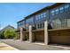 A row of modern townhomes features private balconies, garages, and landscaped front yards at 6790 Encore Blvd, Sandy Springs, GA 30328