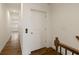 Hallway featuring elevator, hardwood flooring, and bright walls at 6790 Encore Blvd, Sandy Springs, GA 30328