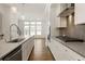 The white kitchen offers a large island and stainless steel appliances at 6790 Encore Blvd, Sandy Springs, GA 30328