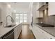 Open concept kitchen with a long island, stainless steel appliances, and modern cabinets at 6790 Encore Blvd, Sandy Springs, GA 30328