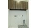 Laundry room area with upper cabinets and hookups for washer and dryer at 6790 Encore Blvd, Sandy Springs, GA 30328