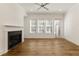 Spacious living room featuring hardwood floors, fireplace, and plenty of natural light at 6790 Encore Blvd, Sandy Springs, GA 30328