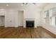 Bright living room with hardwood flooring, fireplace, and ample closet space at 6790 Encore Blvd, Sandy Springs, GA 30328