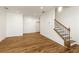Open-concept living room with hardwood floors and staircase, perfect for modern living at 6790 Encore Blvd, Sandy Springs, GA 30328