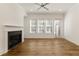 Living room with fireplace, ceiling fan, and natural light at 6790 Encore Blvd, Sandy Springs, GA 30328