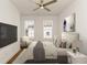 Well-lit main bedroom with a queen-sized bed, ceiling fan, and modern decor at 6790 Encore Blvd, Sandy Springs, GA 30328