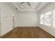 Open main bedroom with hardwood flooring and large windows; leading to an ensuite bathroom at 6790 Encore Blvd, Sandy Springs, GA 30328