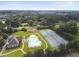 An aerial view shows a community pool, tennis courts, clubhouse, and surrounding homes at 859 Heritage Lake Way, Grayson, GA 30017