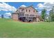 View of the home's backyard featuring a patio and deck at 859 Heritage Lake Way, Grayson, GA 30017