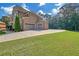 Spacious backyard with lush green lawn and attached garage offering ample parking and storage at 859 Heritage Lake Way, Grayson, GA 30017