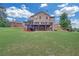 Extensive backyard with a tiered deck and patio combination perfect for outdoor gatherings and relaxation at 859 Heritage Lake Way, Grayson, GA 30017