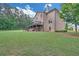 Large backyard with a deck and patio, perfect for outdoor activities and enjoying the surrounding landscape at 859 Heritage Lake Way, Grayson, GA 30017