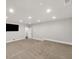 Finished basement with carpet, tv hookup and recessed lighting offers a versatile space for various activities at 859 Heritage Lake Way, Grayson, GA 30017