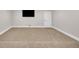 Spacious basement featuring neutral paint, carpet flooring, and tv hookup, perfect for entertainment at 859 Heritage Lake Way, Grayson, GA 30017