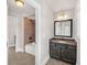 Bathroom boasts tile shower and tub, granite countertop vanity, and designer lighting at 859 Heritage Lake Way, Grayson, GA 30017