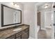 Bathroom with granite counter vanity and view to the tub/shower combo in the adjacent room at 859 Heritage Lake Way, Grayson, GA 30017