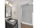 Bathroom with a granite countertop, a framed mirror and nice vanity at 859 Heritage Lake Way, Grayson, GA 30017