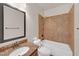 Bathroom featuring a tub-shower combination and a large mirror above a granite-topped vanity at 859 Heritage Lake Way, Grayson, GA 30017