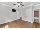 Bedroom boasts hardwood floors, a modern ceiling fan, and ample natural light at 859 Heritage Lake Way, Grayson, GA 30017