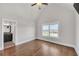 Bedroom with hardwood floors, large window with view, and en-suite bathroom at 859 Heritage Lake Way, Grayson, GA 30017