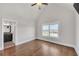 Bedroom with hardwood floors and view to ensuite bathroom with granite counter vanity at 859 Heritage Lake Way, Grayson, GA 30017