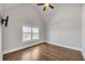 Bedroom with a vaulted ceiling, hardwood flooring, and window overlooking the neighborhood at 859 Heritage Lake Way, Grayson, GA 30017