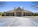 Front view of community clubhouse with large parking lot at 859 Heritage Lake Way, Grayson, GA 30017