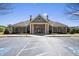 Community clubhouse with ample parking and welcoming entrance offers various amenities to residents at 859 Heritage Lake Way, Grayson, GA 30017