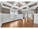 Dining room showcases coffered ceiling, gray accent wall, large window and hardwood floors at 859 Heritage Lake Way, Grayson, GA 30017