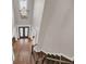Bright foyer with hardwood floors and a modern chandelier, leading to elegant double doors at 859 Heritage Lake Way, Grayson, GA 30017