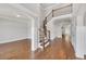 Elegant foyer with hardwood floors, a wrought iron staircase, and neutral paint colors for a sophisticated look at 859 Heritage Lake Way, Grayson, GA 30017