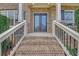 Close up of grand brick entryway with leaded glass double doors and iron railing at 859 Heritage Lake Way, Grayson, GA 30017
