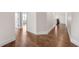 Inviting hallway with gleaming hardwood floors and crisp white trim at 859 Heritage Lake Way, Grayson, GA 30017