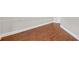 Clean hardwood flooring in a walk-in closet with white baseboards and shelving unit at 859 Heritage Lake Way, Grayson, GA 30017