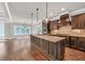 Spacious kitchen features a large central island with granite countertops and modern appliances at 859 Heritage Lake Way, Grayson, GA 30017