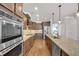 Beautiful kitchen with stainless steel appliances, granite counters, and a large island for entertaining at 859 Heritage Lake Way, Grayson, GA 30017