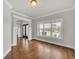 Bright living room with hardwood floors, large window and arched entrance at 859 Heritage Lake Way, Grayson, GA 30017