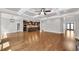 Open concept living room with coffered ceiling, hardwood floors and view into the kitchen at 859 Heritage Lake Way, Grayson, GA 30017