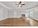 Inviting main bedroom with a cozy fireplace and a modern ceiling fan at 859 Heritage Lake Way, Grayson, GA 30017